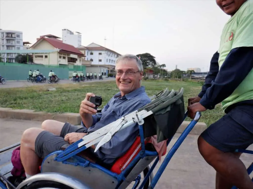 George Sranko touring Phnom Penh, Cambodia by Cyclo. Photo by Jan Cadieux