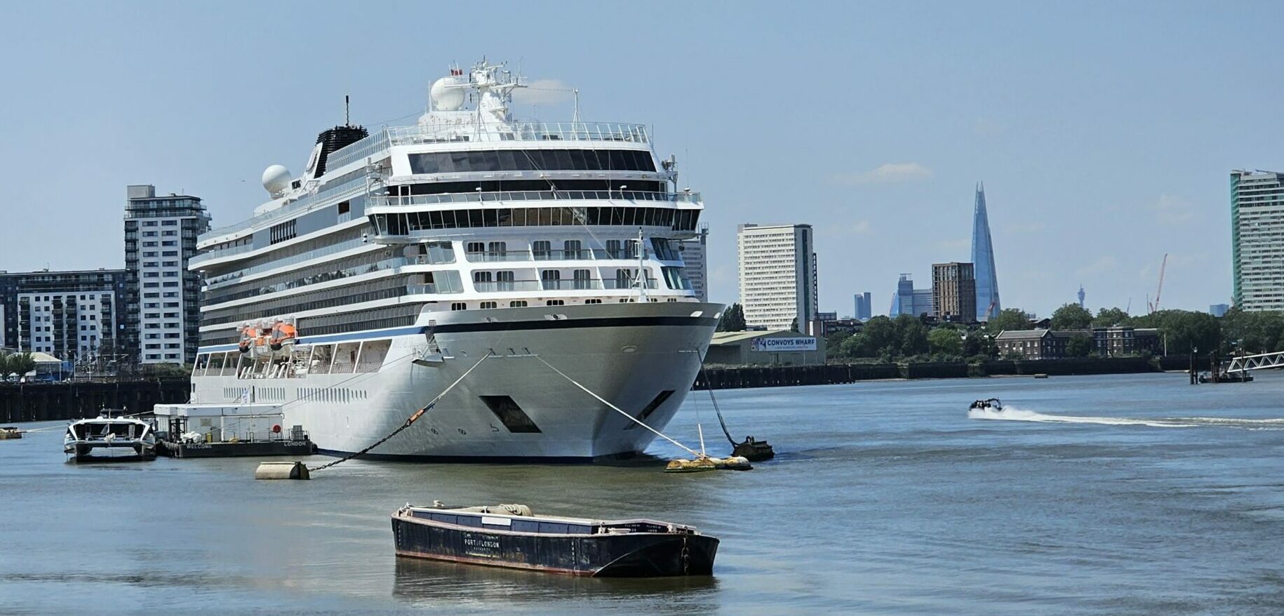 A lecturer may discuss the Viking cruise ship docked on the River Thames.